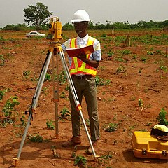 Man using a Total Station or total station theodolite